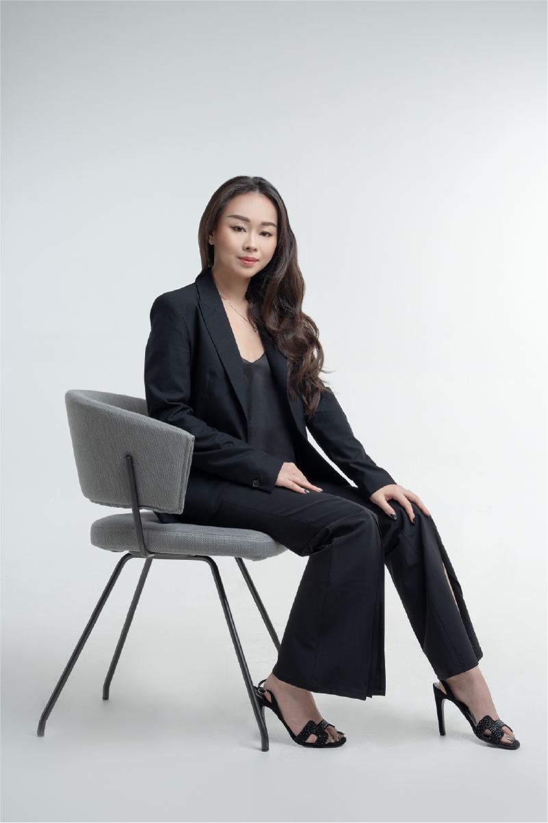 Claudia Apriliana sitting on a modern chair