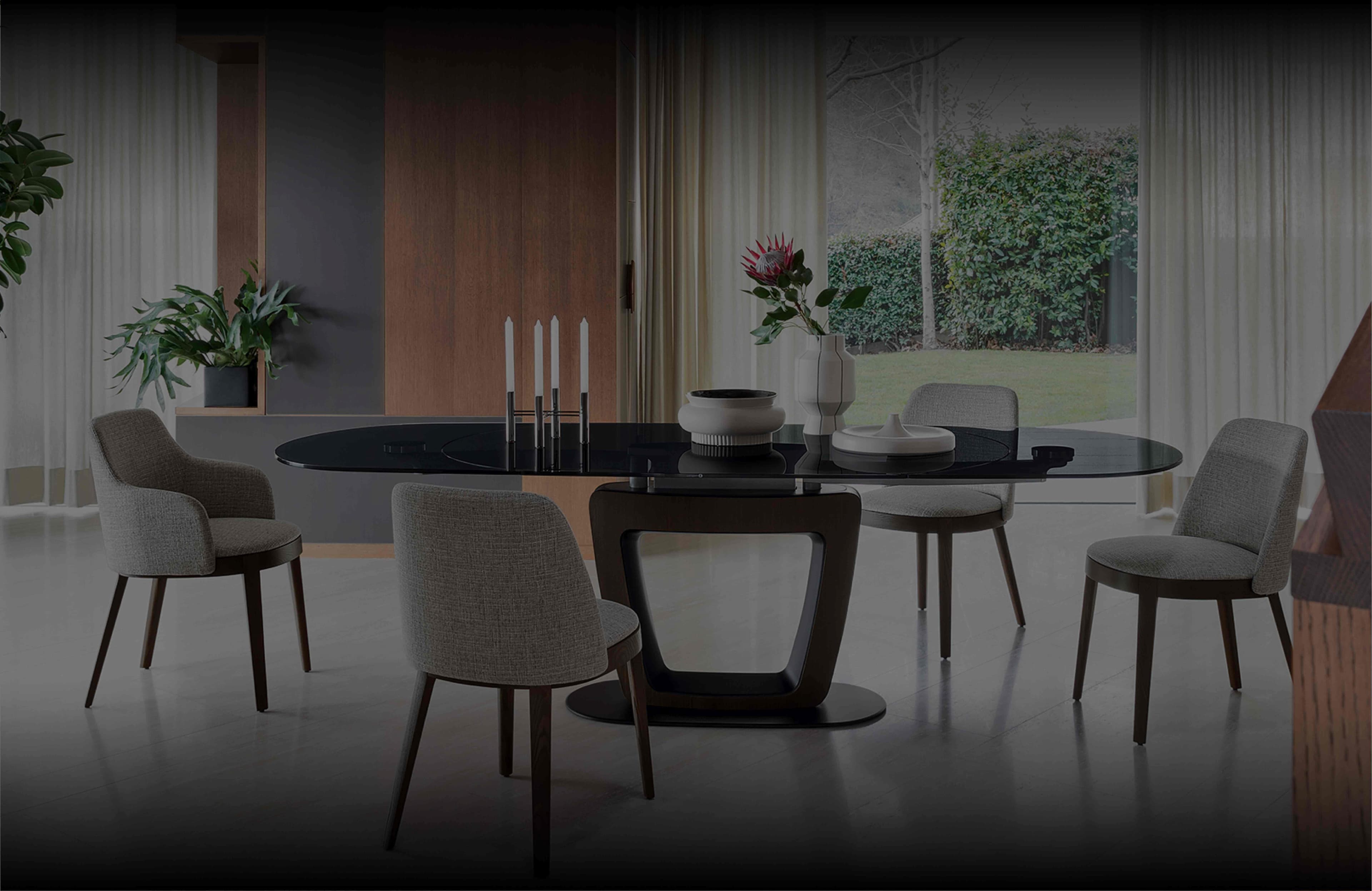 Calligaris modern dining room with black oval table, grey upholstered chairs and contemporary interior design